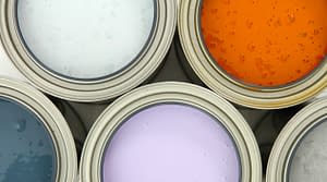 selection of paints cans with lids removed