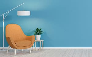 sky blue wall with chair