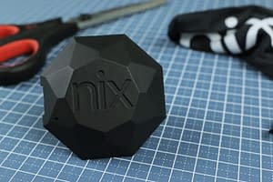 A Nix Pro sits on top of a graphing cutting board