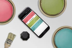 Three Paint cans are opened, showing bright colours. A phone and Nix Mini sit beside the paint cans. The paint colours match the suggested matches from the Nix Mini app.