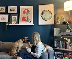 Woman with dog in decorated room