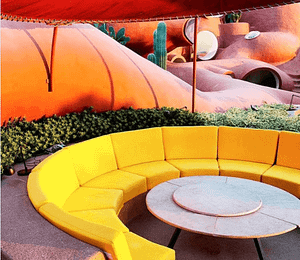 Yellow seating at Antti Lovag 1970's bubble house by Odile Decq