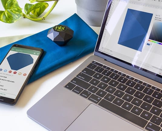Nix Pro 2 Color Sensor at desk on blue fabric