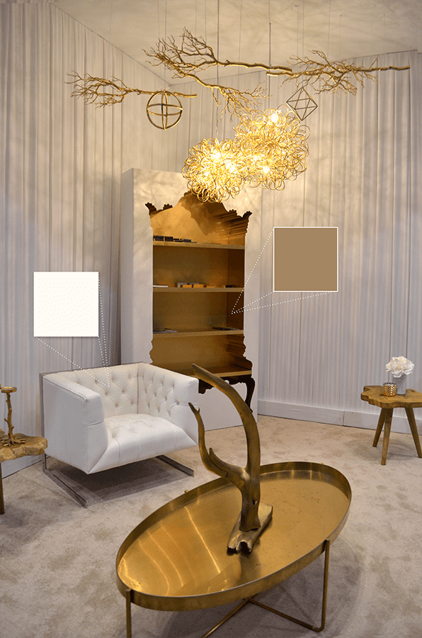 NettHaus' ornate bookshelf featuring warm golds and clean white