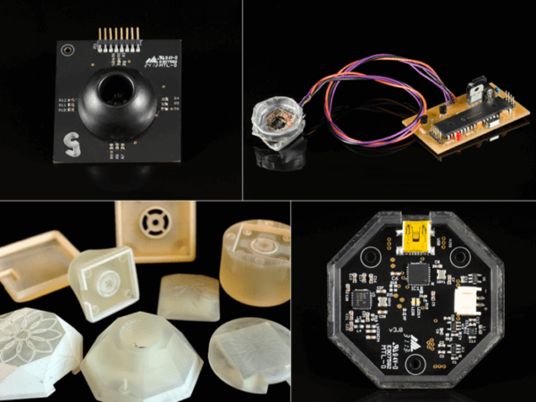 A circuit board, 3D printed prototyping bits, and electronic arts forma collage