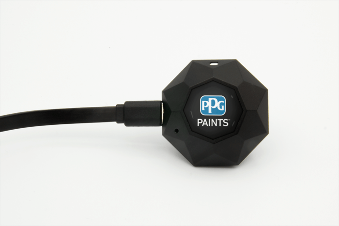 The PPG Mini has its charging cable plugged in