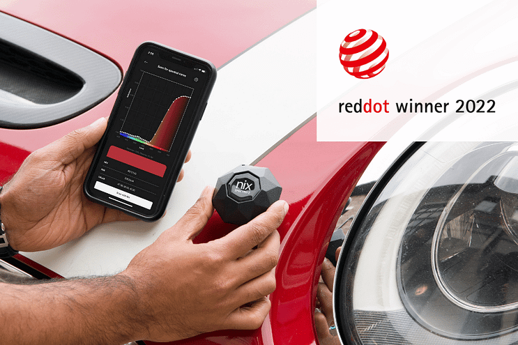 Spectrophotometer scanning red car with reddot winner badge